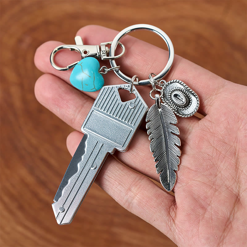 Porte-clés couteau pliant argenté avec pendentif turquoise et plume de style western - image 4