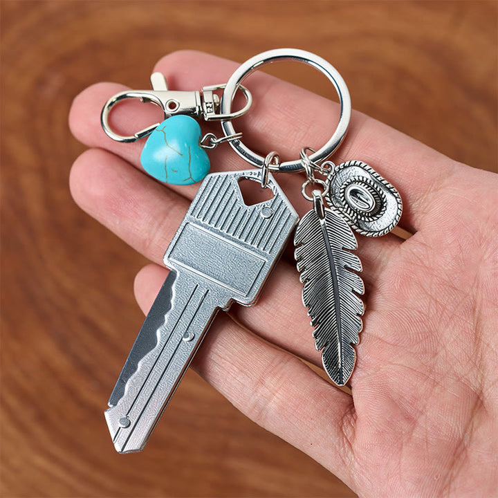 Porte-clés couteau pliant argenté avec pendentif turquoise et plume de style western - image 4