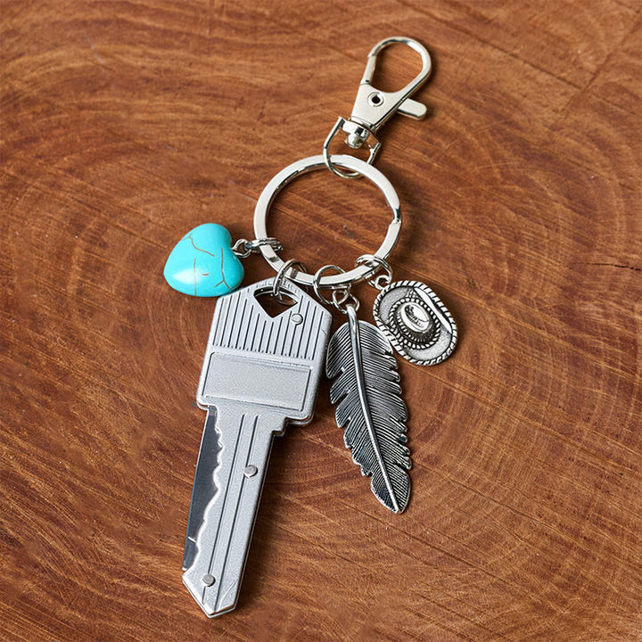 Porte-clés couteau pliant argenté avec pendentif turquoise et plume de style western - image 6