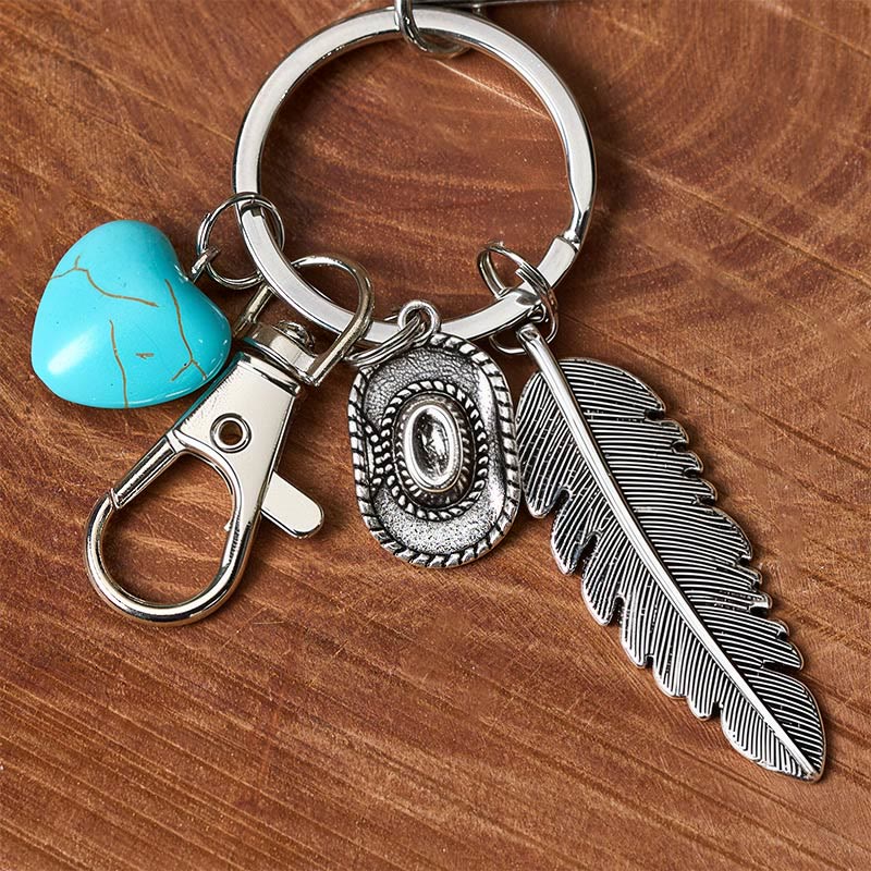 Porte-clés couteau pliant argenté avec pendentif turquoise et plume de style western - image 3