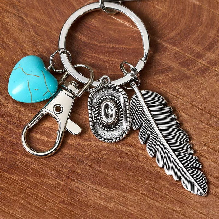 Porte-clés couteau pliant argenté avec pendentif turquoise et plume de style western - image 3