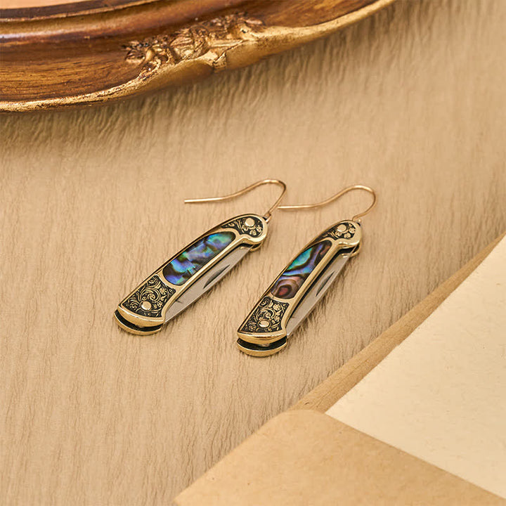 Boucles d'oreilles artisanales en forme de couteau de poche en nacre irisée. - image 5