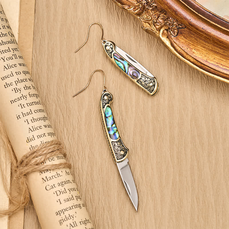 Boucles d'oreilles artisanales en forme de couteau de poche en nacre irisée. - image 1
