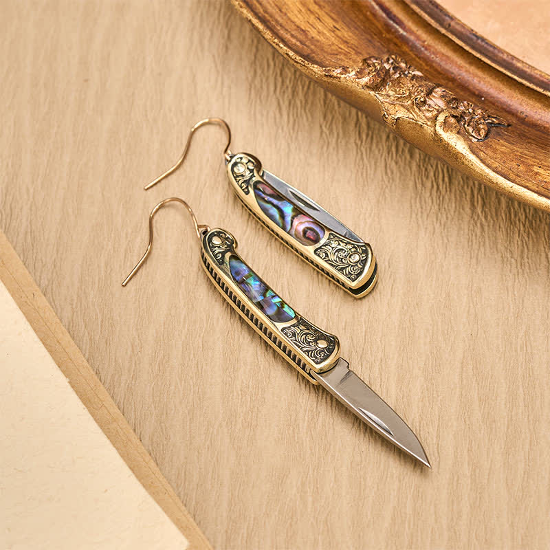 Boucles d'oreilles artisanales en forme de couteau de poche en nacre irisée. - image 4