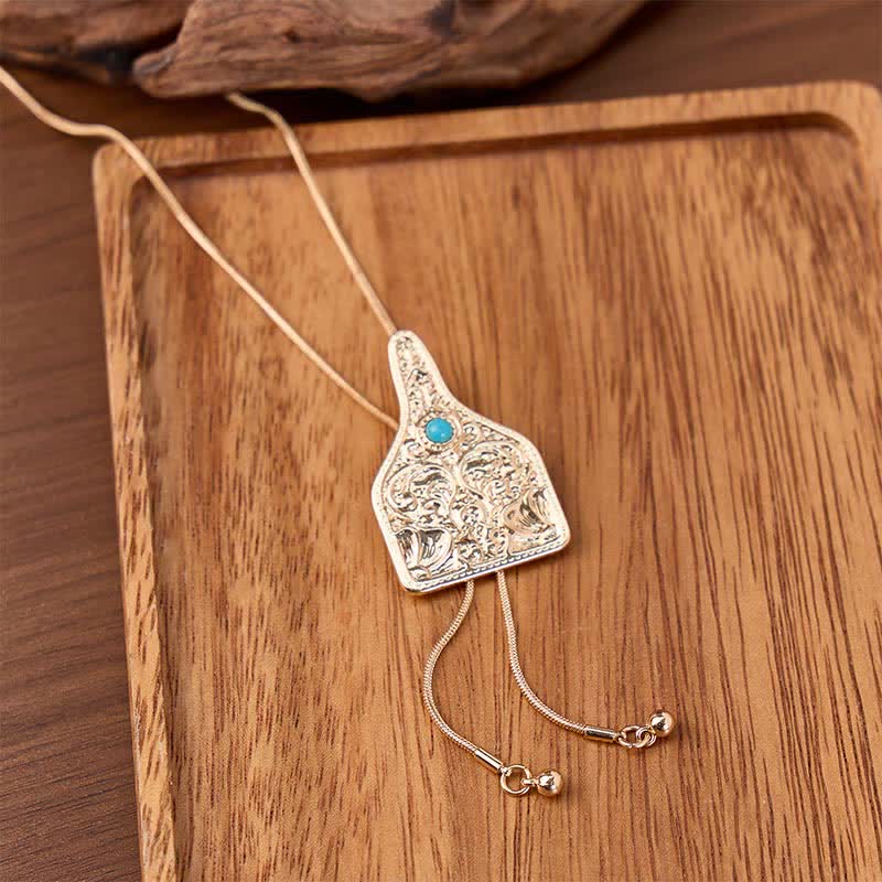 Collier bolo en forme de Y orné de turquoise et portant une étiquette d'identification pour bétail - Or - image 0