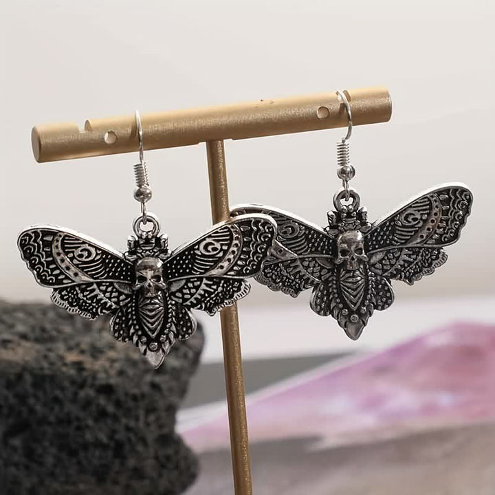 Boucles d'oreilles gothiques vintage envoûtantes, motif papillon de nuit et crâne - image 1