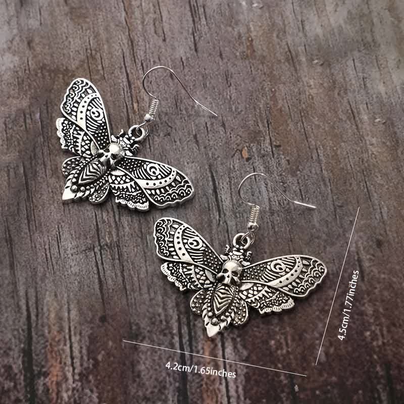 Boucles d'oreilles gothiques vintage envoûtantes, motif papillon de nuit et crâne - image 2