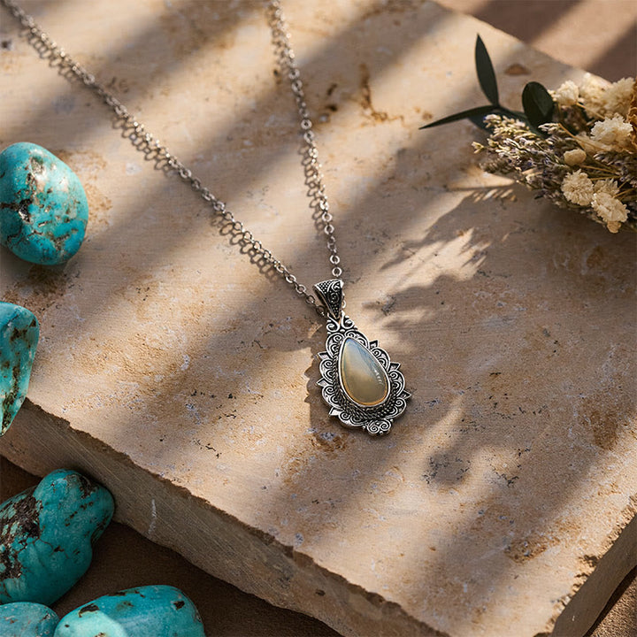 Collier pendentif vintage en filigrane en forme de larme et pierre de lune - image 4