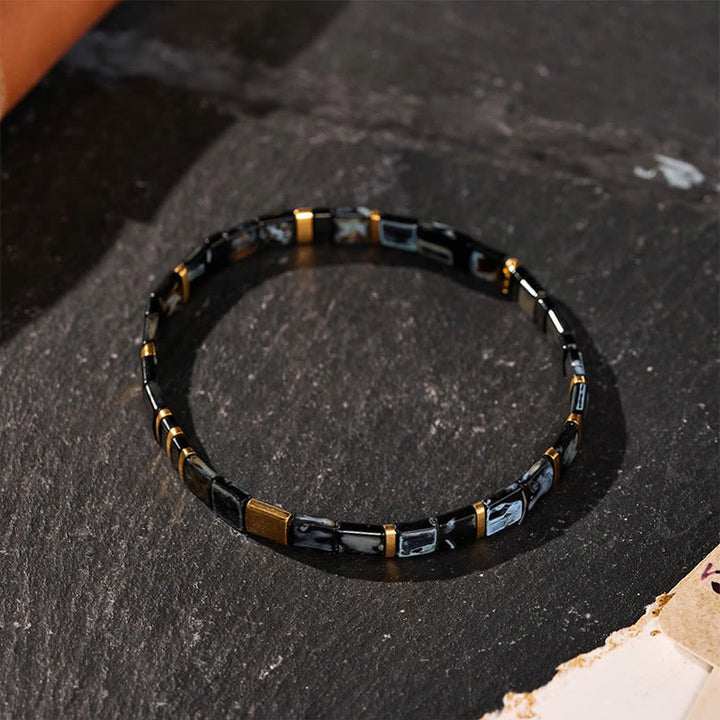 Bracelet vintage en perles Tila noires et dorées - image 0