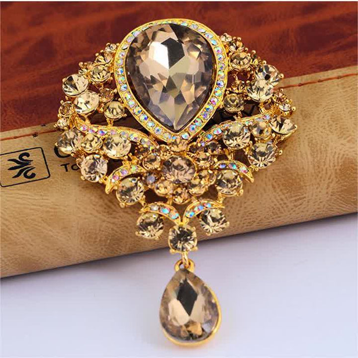 Broche en forme de goutte d'eau en verre transparent pour femme