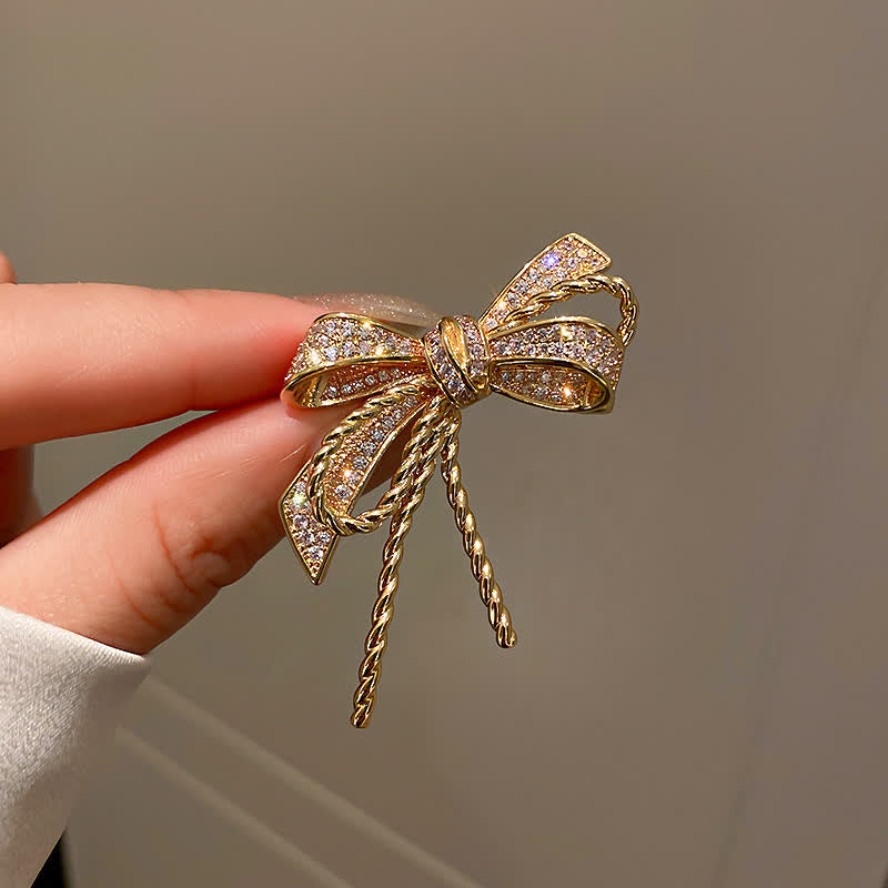 Jolie broche en zircons pour femme avec noeud papillon
