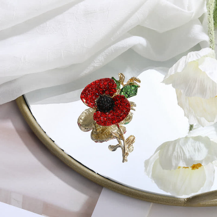 Broche pour femme en forme de coquelicot et de carthame