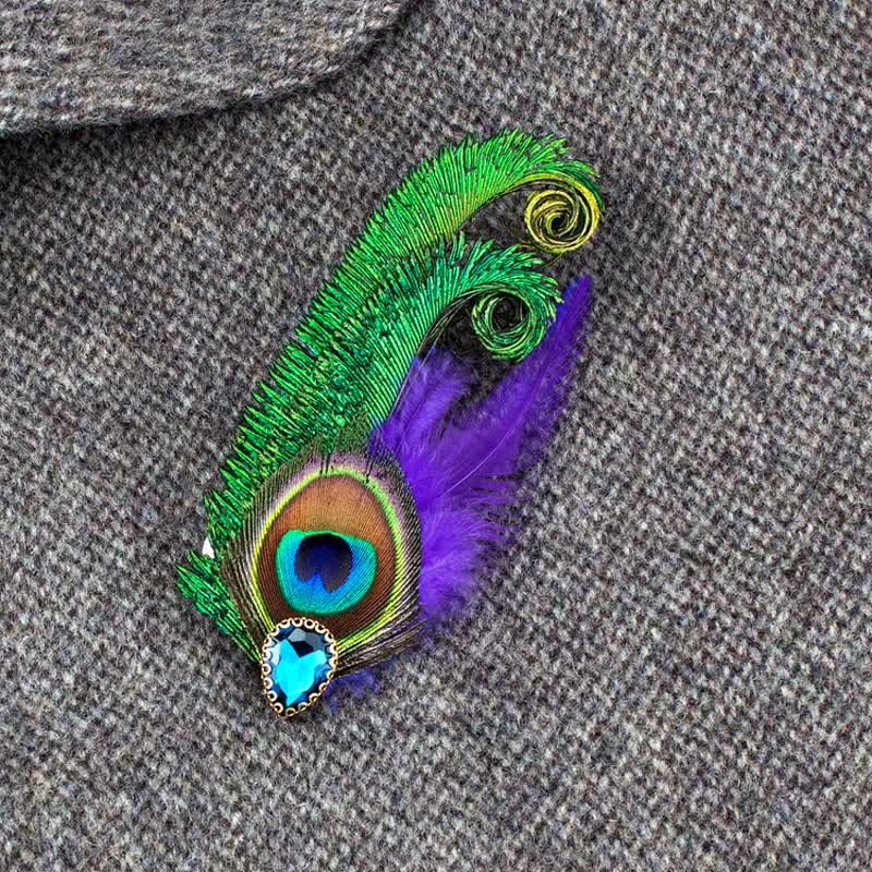 Broche en strass avec plumes d'oeil de paon