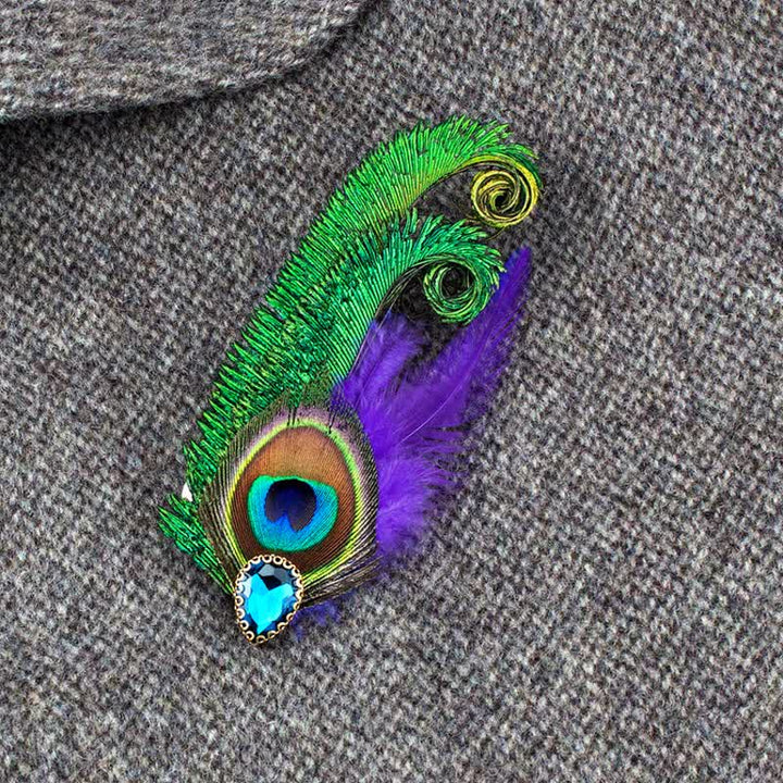 Broche en strass avec plumes d'oeil de paon
