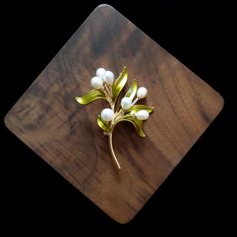 Broche pour femme en perles naturelles et rameau d'olivier