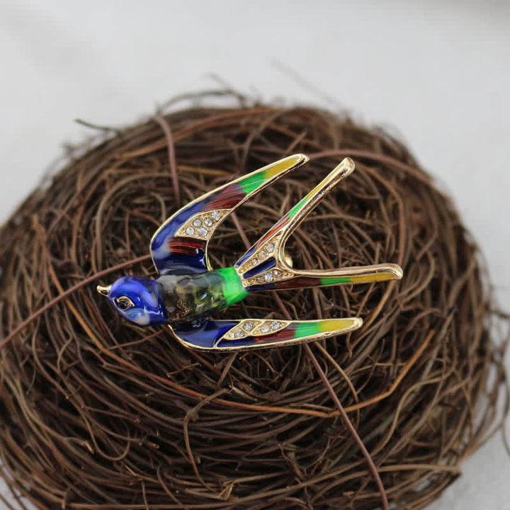 Jolie broche hirondelle en émail pour femme