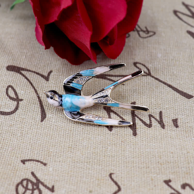 Jolie broche hirondelle en émail pour femme
