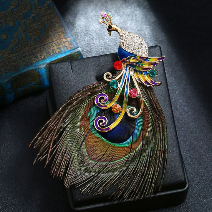 Broche ethnique en plumes de paon colorées pour femme