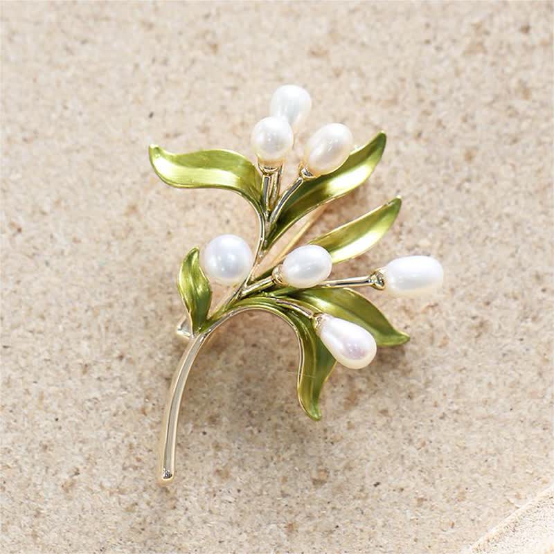 Broche pour femme en perles naturelles et rameau d'olivier