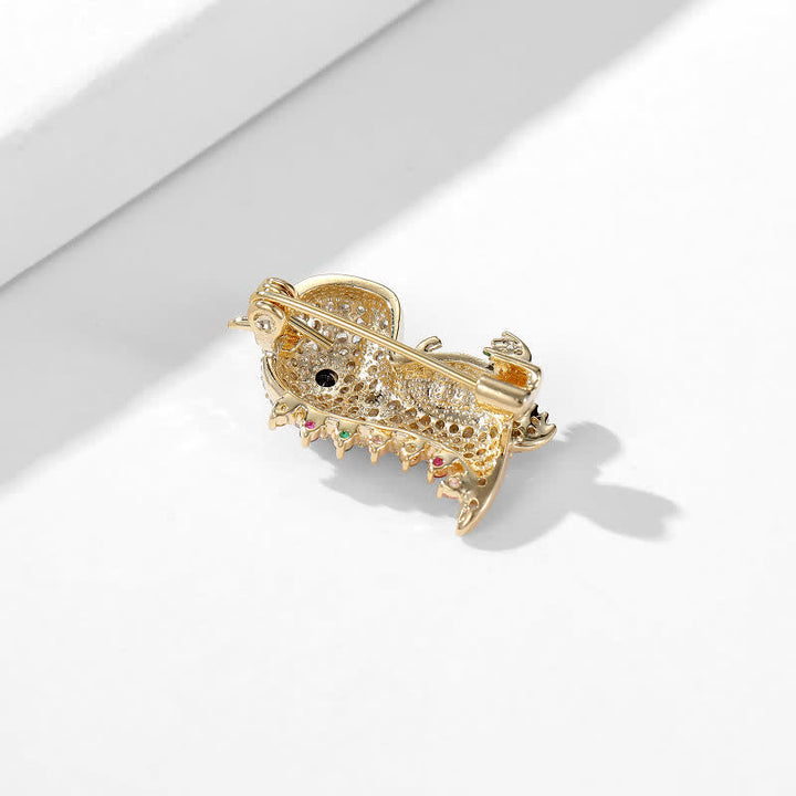 Broche de dinosaure scintillante pour femme