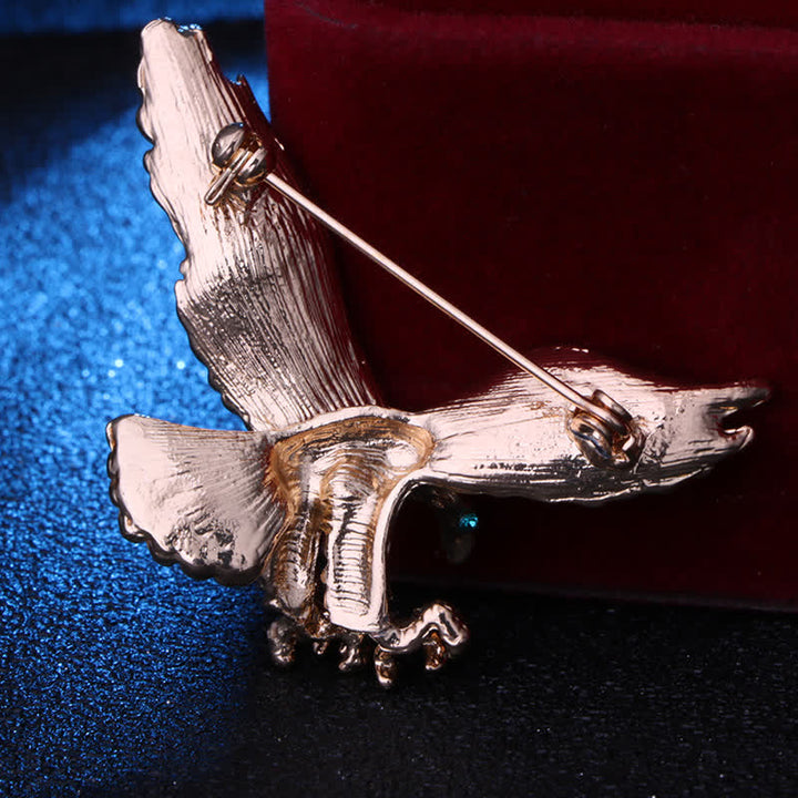 Broche œil vert pour homme avec buse chauve