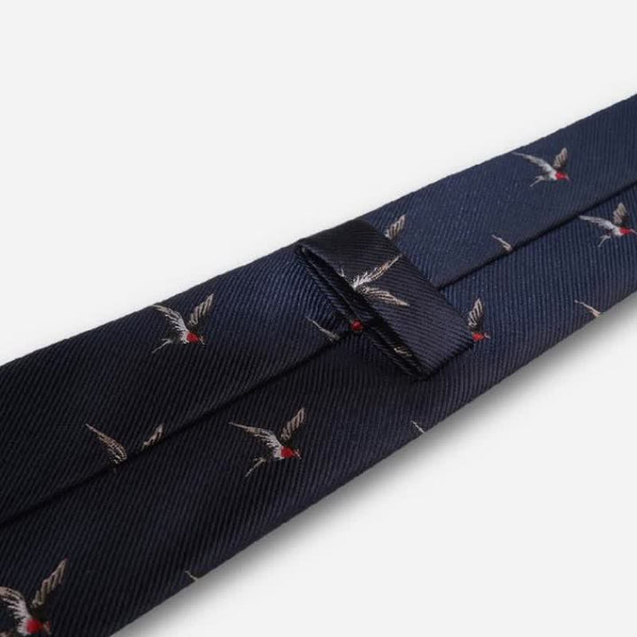 Cravate tissée brodée bleu marine pour homme avec motif hirondelle