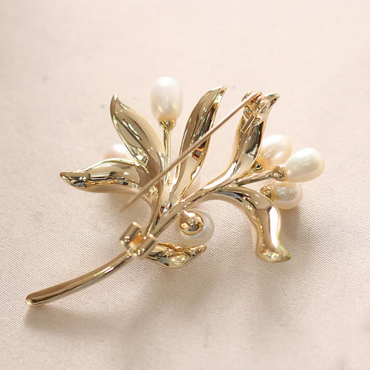 Broche pour femme en perles naturelles et rameau d'olivier