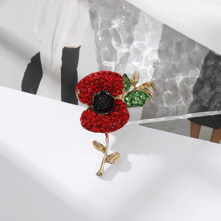 Broche pour femme en forme de coquelicot et de carthame