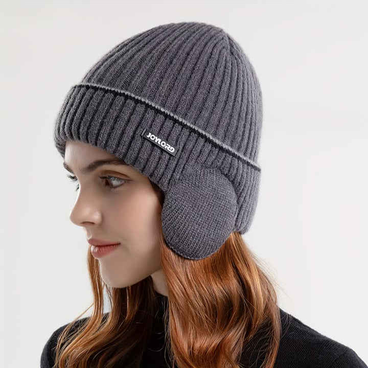 Bonnet unisexe en tricot épais et élastique avec cache-oreilles de couleur unie