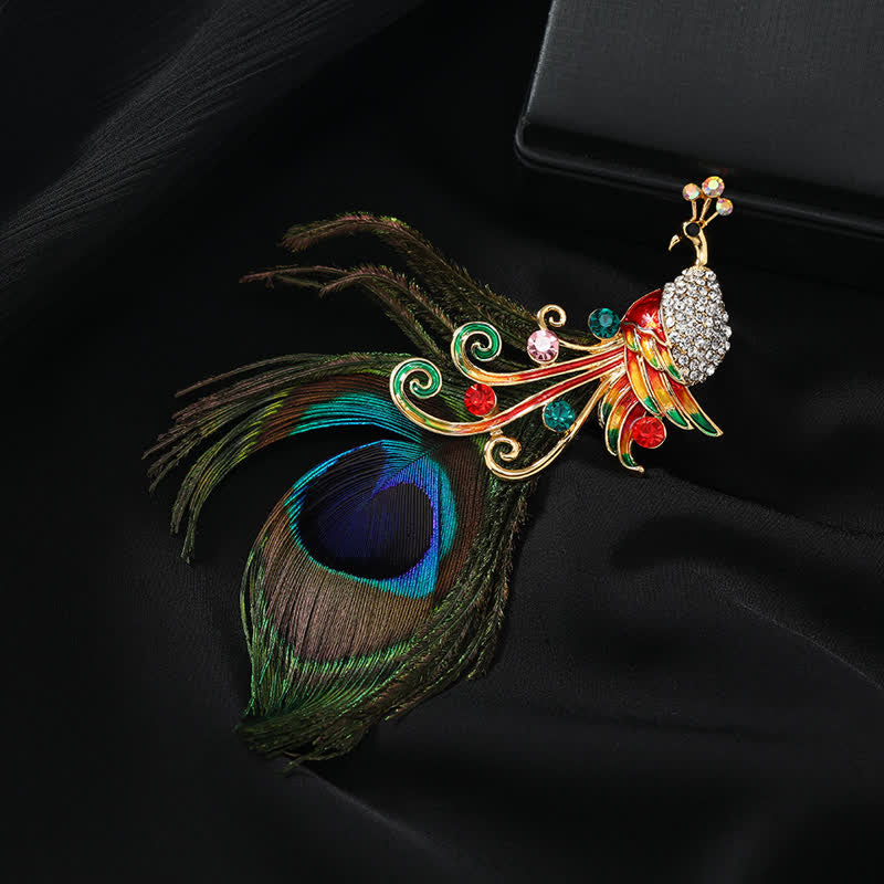 Broche ethnique en plumes de paon colorées pour femme