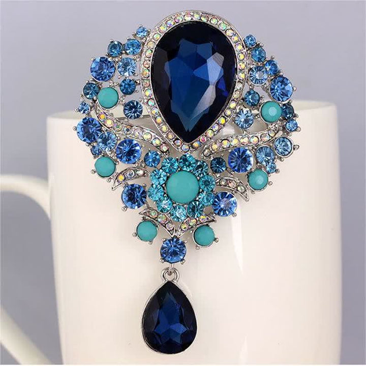 Broche en forme de goutte d'eau en verre transparent pour femme
