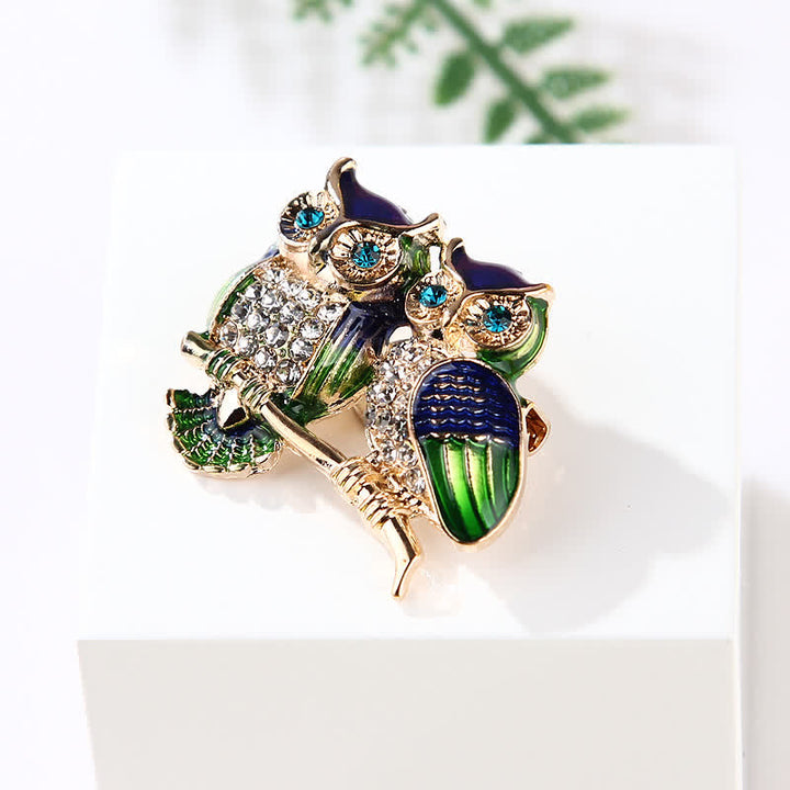 Broche pour femme avec deux hiboux sur une branche