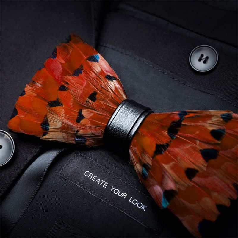Nœud papillon en plumes de queue de pinson orange vif avec épingle à revers