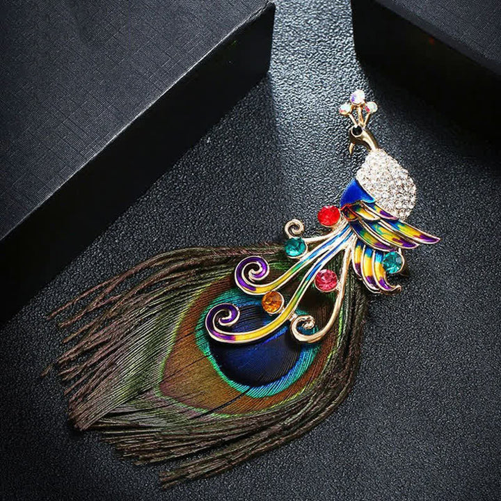 Broche ethnique en plumes de paon colorées pour femme