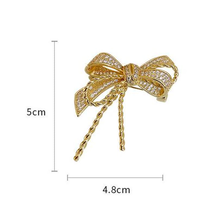 Jolie broche en zircons pour femme avec noeud papillon