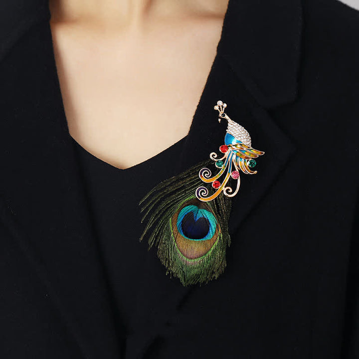 Broche ethnique en plumes de paon colorées pour femme