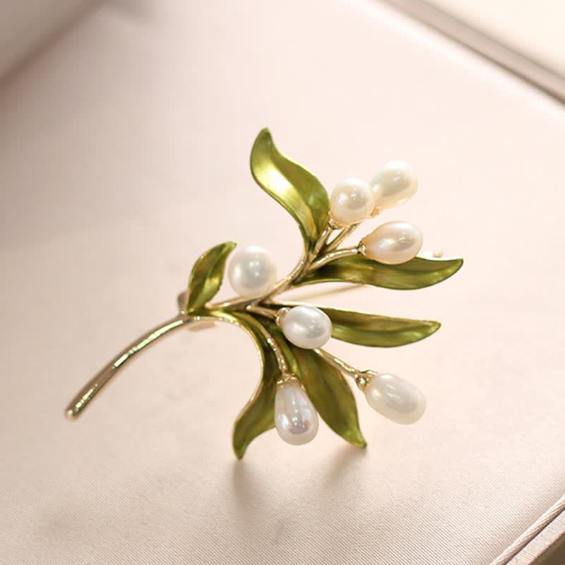 Broche pour femme en perles naturelles et rameau d'olivier