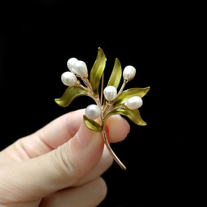 Broche pour femme en perles naturelles et rameau d'olivier